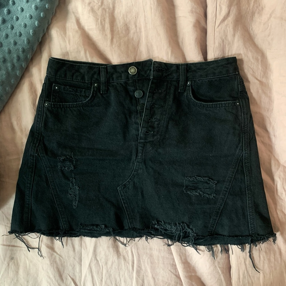 Denim mini skirt with distressed hem